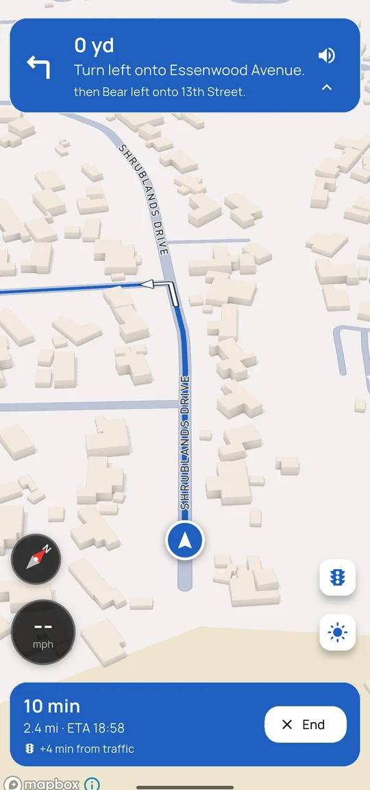 Turn-by-turn navigation with a left-turn instruction at the top and a trip bar at the bottom showing 10 minutes, 2.4 miles, an arrival time, and plus 4 minutes from traffic, with an End button.